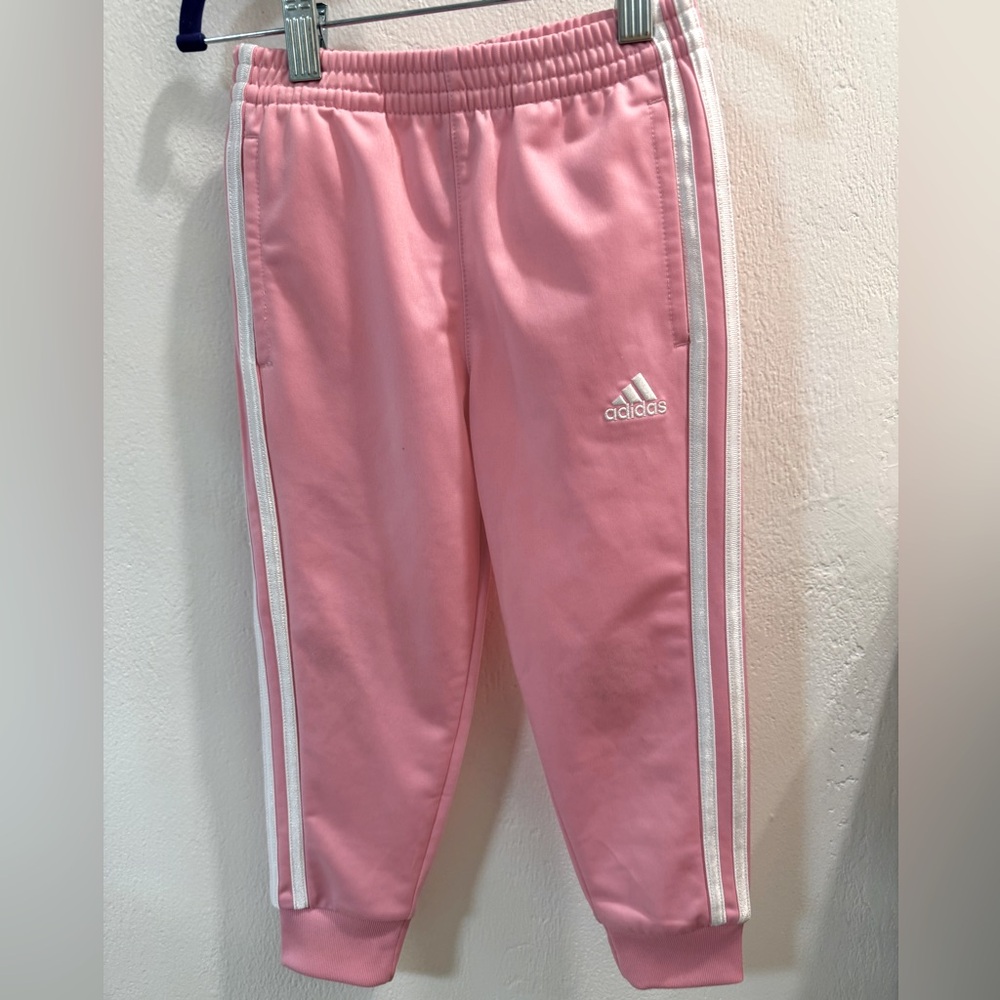 Adidas 3 stripe jogger style pants.